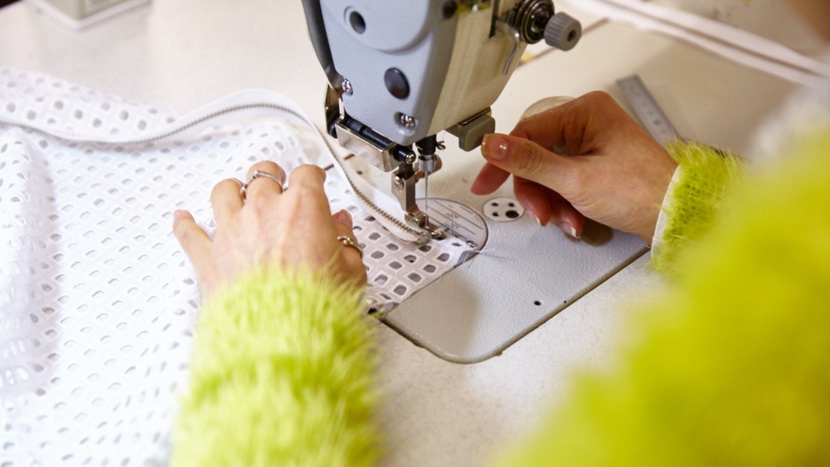 Holly working at the sewing machine